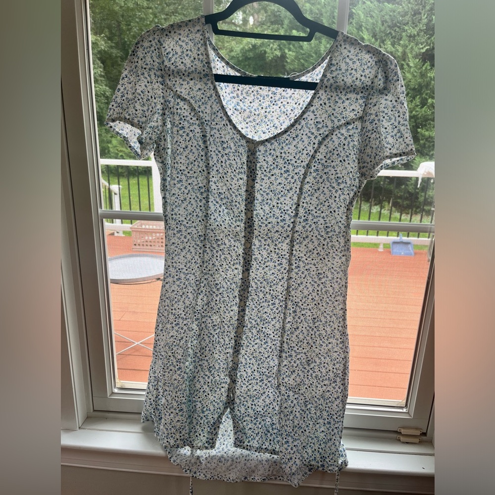 Brandy Melville dress. White with blue flowers and tie in the back.